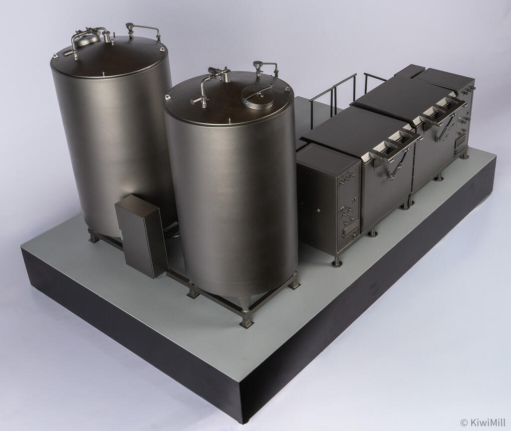 High rear view of the water tank tops with manways and valves, plus a small enclosure between the tank frames